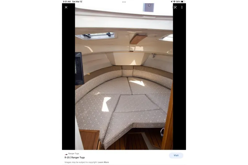 Slide: The Image of Interior cabin of 2022 Ranger Tugs R-25 boat with cushioned seating. - 28