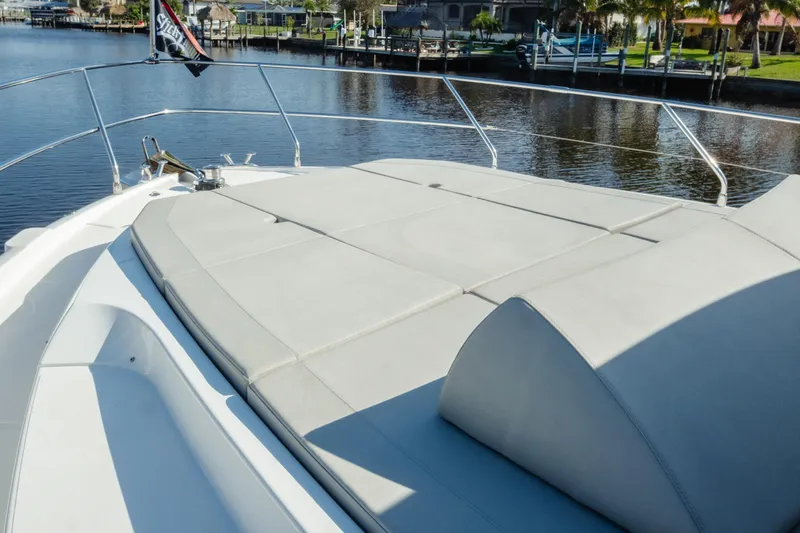 Slide: The Image of Absolute 48 Navetta 2020 yacht docked under clear blue sky. - 10