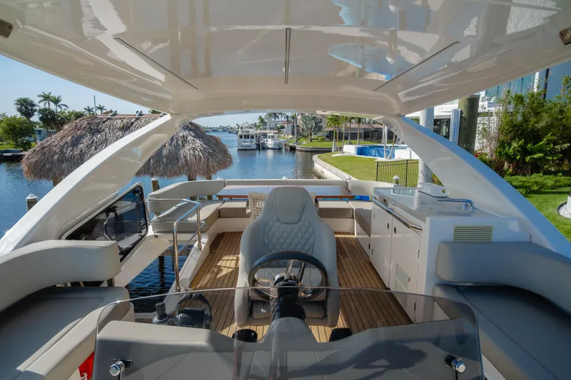 Slide: The Image of Inflatable boat with Suzuki 25 outboard motor docked beside Absolute NAVETTA 48 yacht. - 14