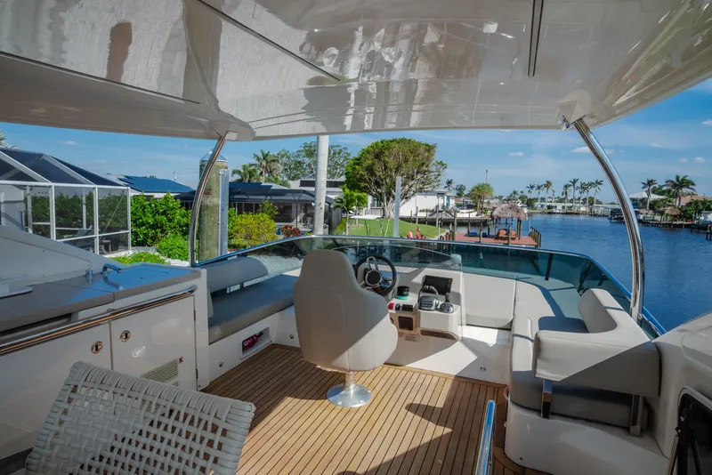 Slide: The Image of Luxury yacht Absolute NAVETTA 48, 2020 model, docked with covered equipment on deck. - 15