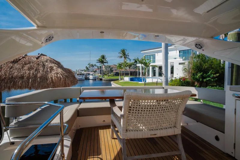 Slide: The Image of 2020 Absolute 48 Navetta yacht with elegant wooden stairs and sleek design. - 17