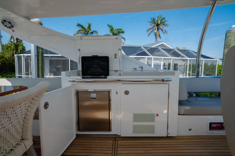 Slide: The Image of Luxury yacht Absolute 48 Navetta 2020 with elegant seating and scenic waterfront view. - 18