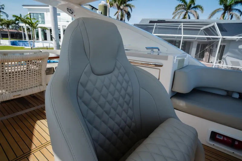 Slide: The Image of Luxury seating area on 2020 Absolute 48 Navetta yacht, featuring sleek design and waterfront view. - 19