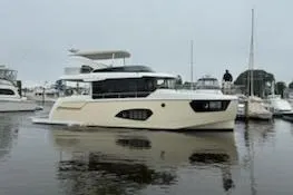 Slide: The Image of Luxury 2020 Absolute NAVETTA 48 yacht cruising on a sunny day. - 2