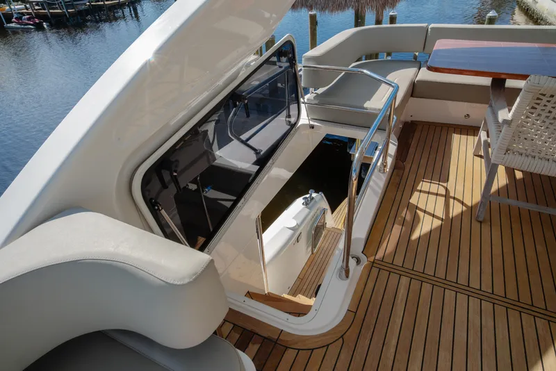 Slide: The Image of Luxury Absolute NAVETTA 48 yacht, 2020 model, docked with spacious deck and scenic water view. - 21