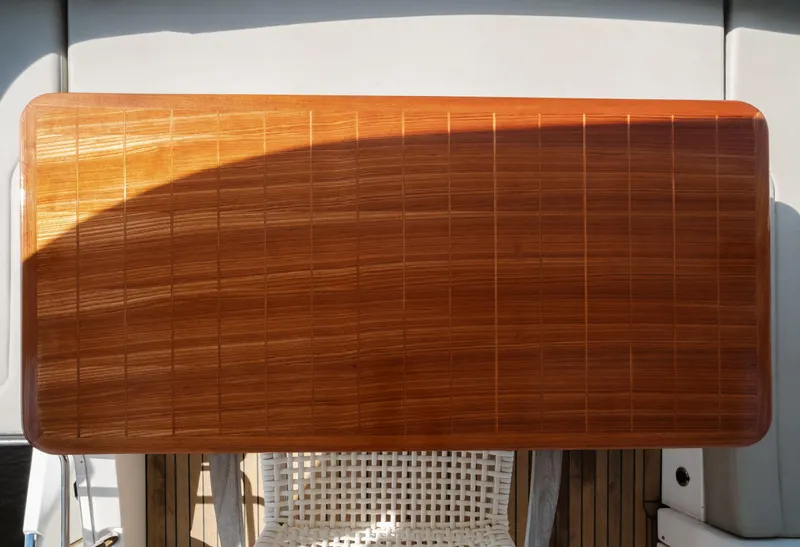 Slide: The Image of Luxurious 2020 Absolute 48 Navetta yacht interior with helm, seating, and waterfront view. - 22