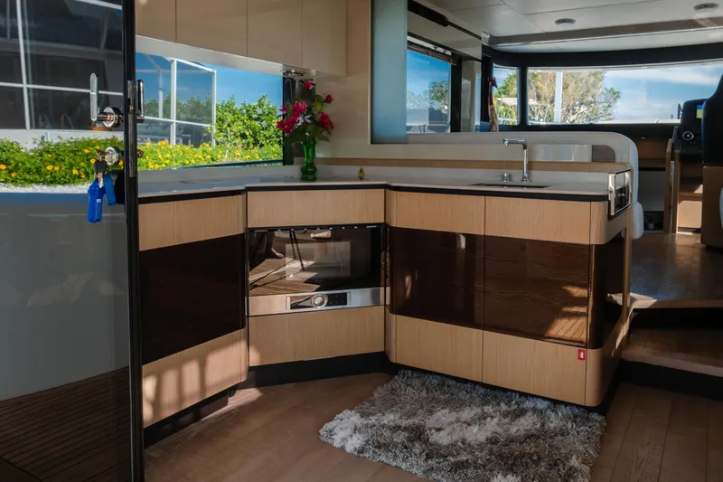 Slide: The Image of Interior view of 2020 Absolute NAVETTA 48 yacht's helm with navigation screens. - 31