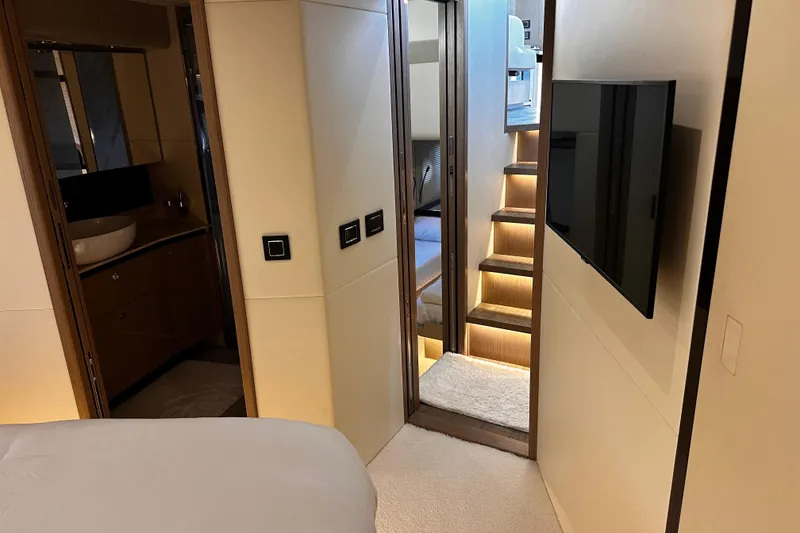 Slide: The Image of Interior view of 2020 Absolute 48 Navetta yacht cockpit with steering wheel and navigation screens. - 33