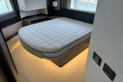 Slide: The Image of Steering wheel and navigation screens of 2020 Absolute 48 Navetta yacht. - 34