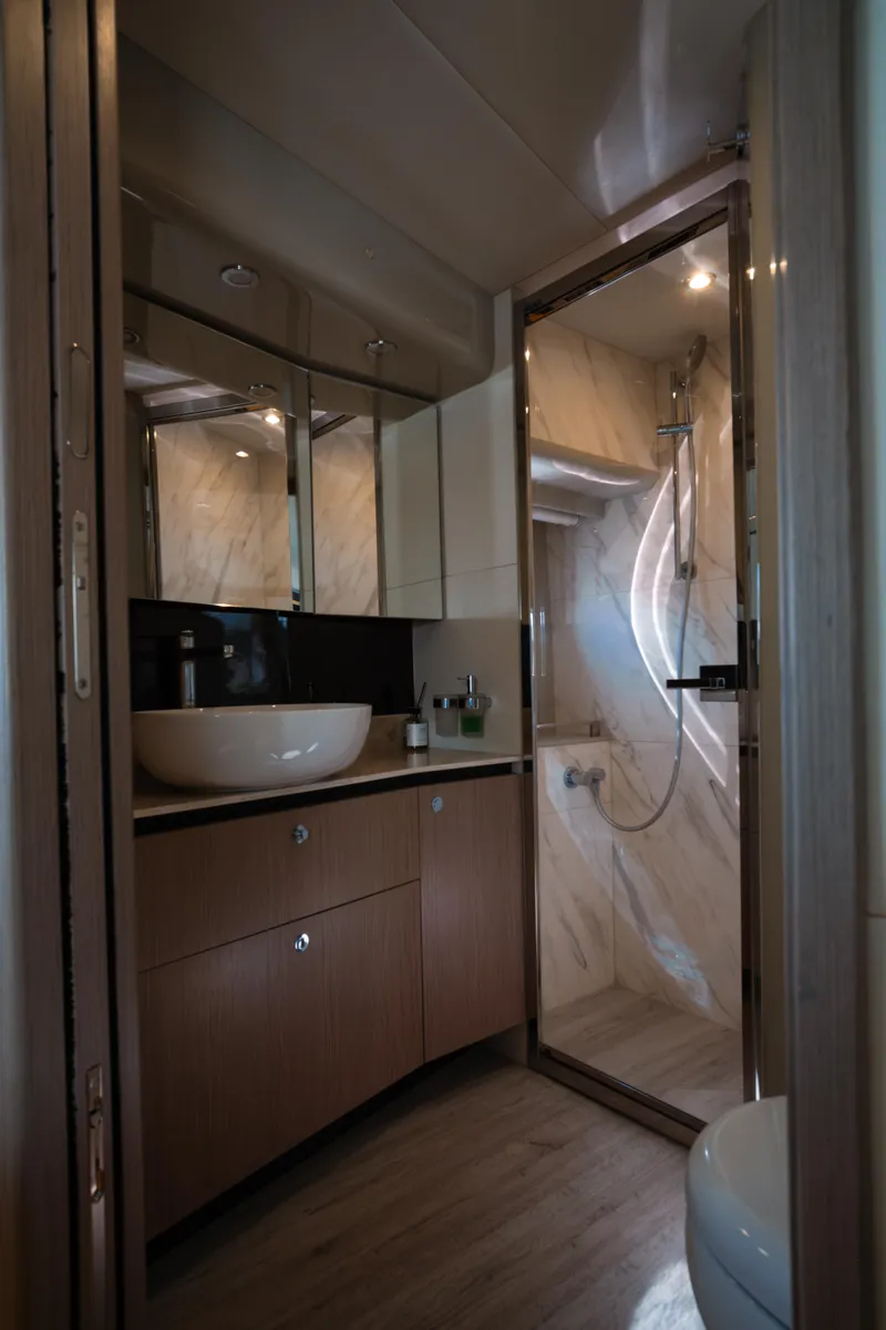 Slide: The Image of Luxurious interior of 2020 Absolute 48 Navetta yacht with modern kitchen and seating area. - 39