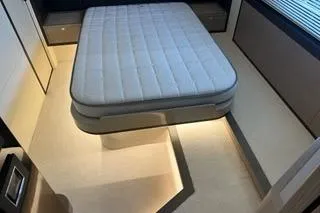 Slide: The Image of Luxurious interior of 2020 Absolute NAVETTA 48 yacht with elegant wooden stairs and cozy cabins. - 41