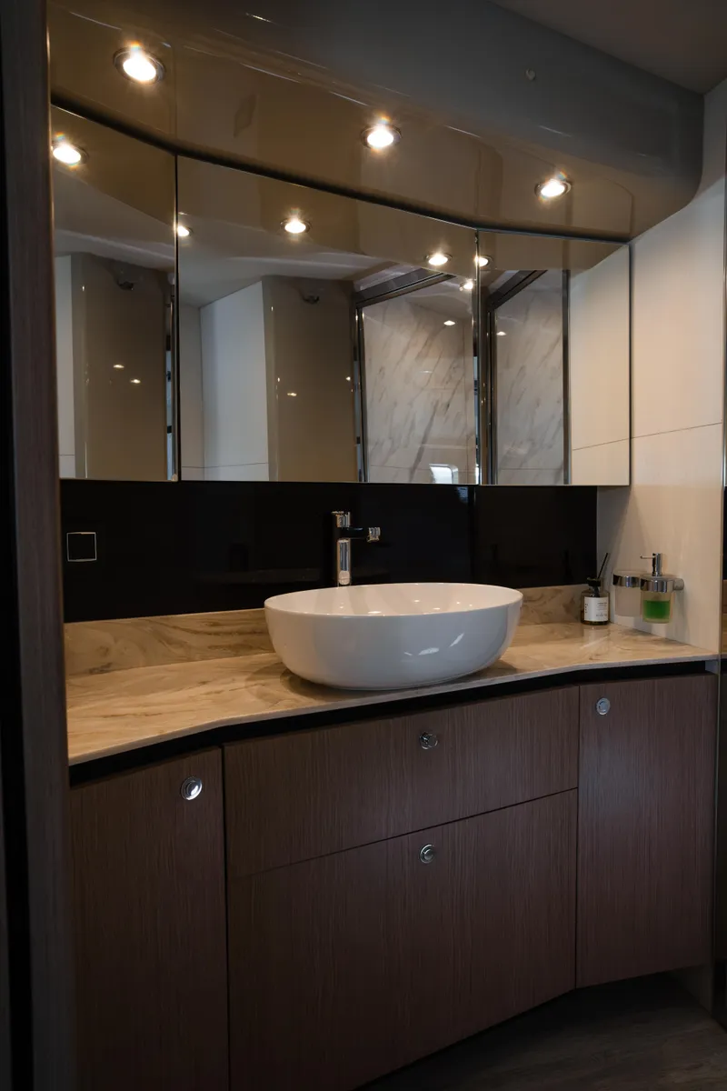 Slide: The Image of Luxurious closet interior on 2020 Absolute 48 Navetta yacht with elegant dresses hanging. - 43