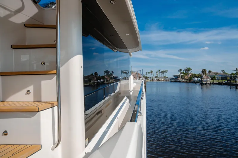 Slide: The Image of 2020 Absolute NAVETTA 48 yacht bow under clear blue sky. - 8