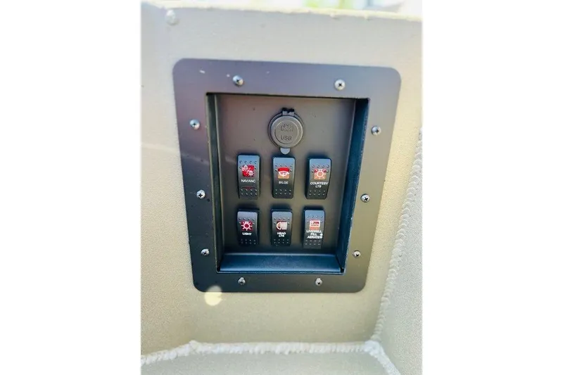 Slide: The Image of Control panel of 2026 Thor 1754 Fish Hammer boat with labeled switches and USB port. - 3
