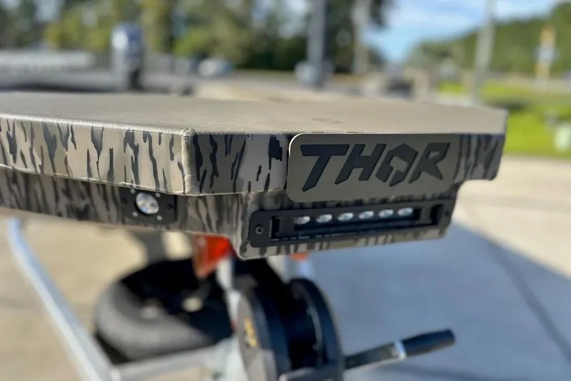 Slide: The Image of Camouflage-patterned Thor 1754 Fish Hammer boat, 2026 model, with logo and LED lights. - 4
