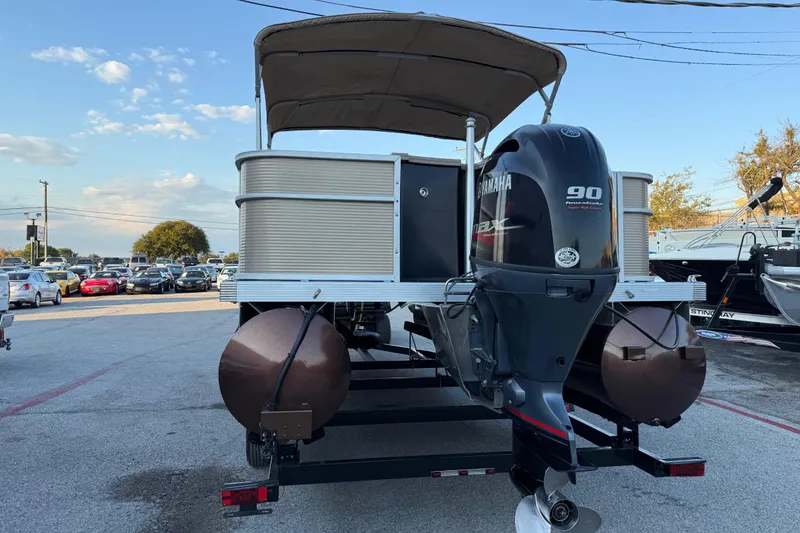 Slide: The Image of 2020 Bennington 21SF pontoon boat with Yamaha outboard motor on trailer. - 17