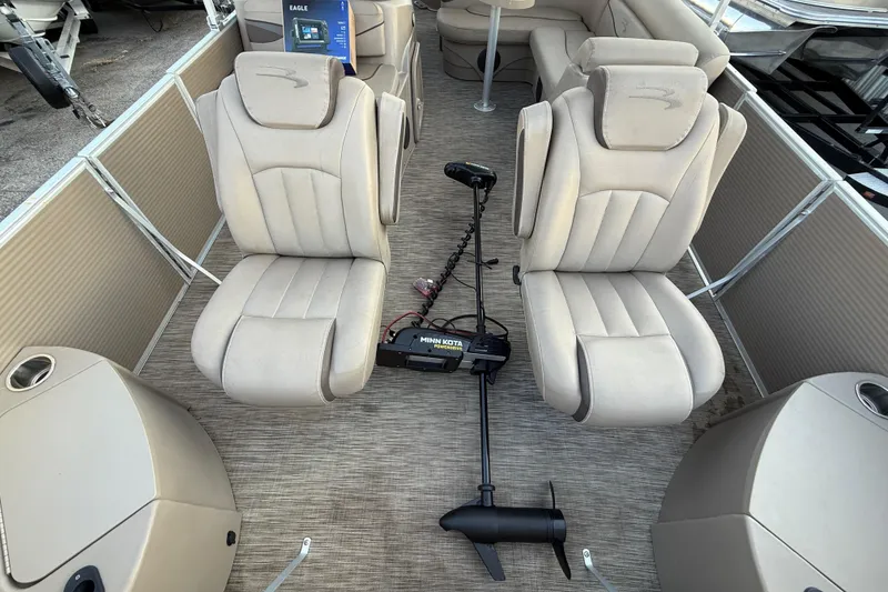 Slide: The Image of 2020 Bennington 21SF boat interior with beige seating and Minn Kota trolling motor. - 27