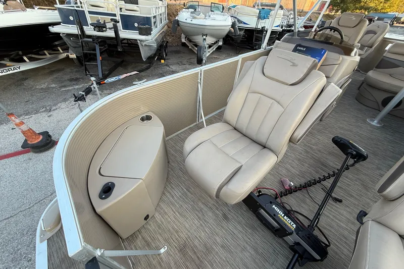 Slide: The Image of 2020 Bennington 21SF boat interior with beige seating and Minn Kota trolling motor. - 28