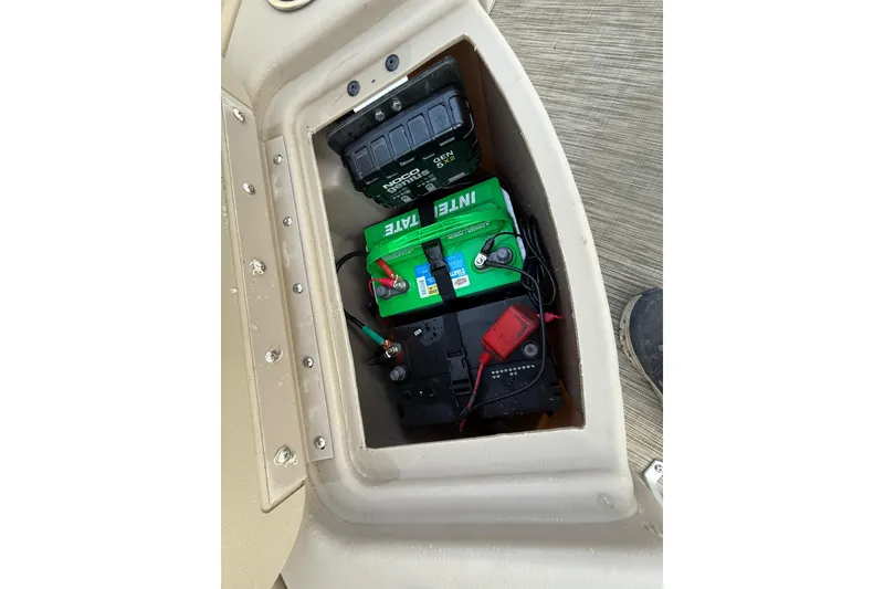 Slide: The Image of 2020 Bennington 21SF pontoon boat interior with seating and Minn Kota trolling motor. - 30