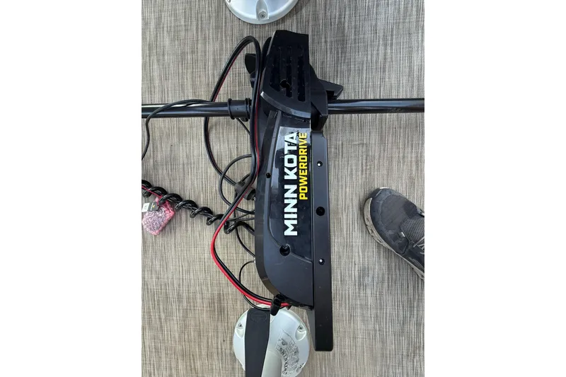 Slide: The Image of Battery compartment of a 2020 Bennington 21SF boat, featuring a green Interstate battery. - 31