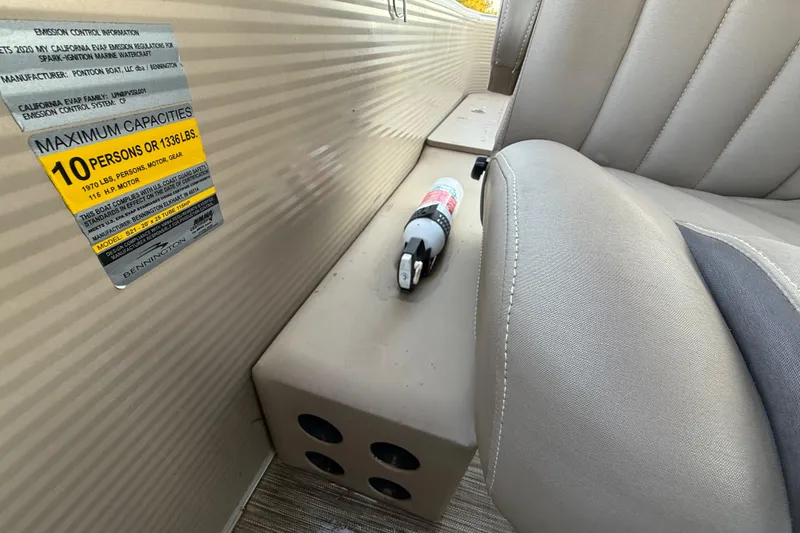 Slide: The Image of 2020 Bennington 21SF boat interior with beige seating and steering console. - 42