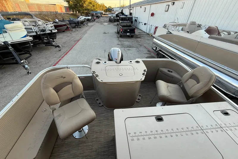 Slide: The Image of 2020 Bennington 21SF pontoon boat interior with seating and storage compartments. - 50