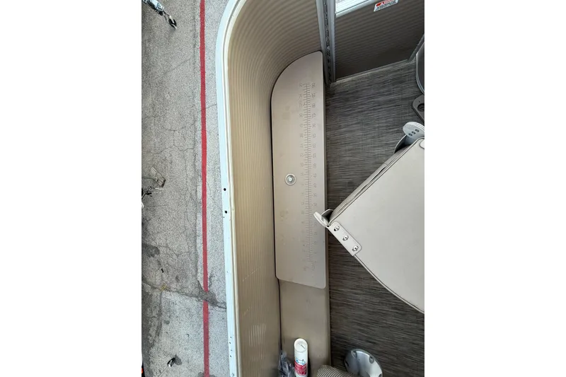 Slide: The Image of 2020 Bennington 21SF pontoon boat interior with seating and control panel. - 51