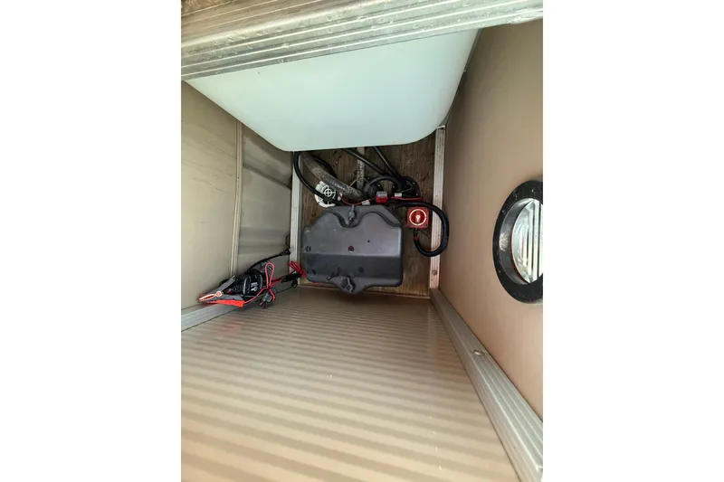 Slide: The Image of Red storage compartment on 2020 Bennington 21SF boat deck. - 58