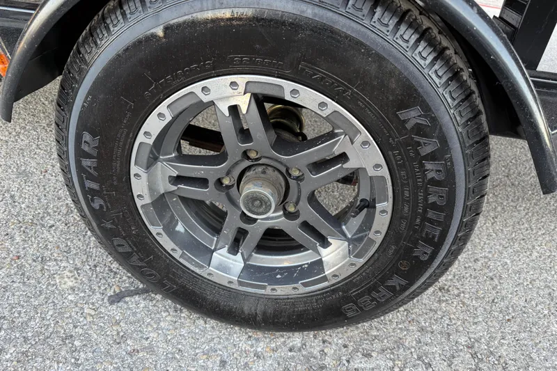 Slide: The Image of Boat trailer latch on a 2020 Bennington 21SF, featuring a secure locking mechanism. - 67