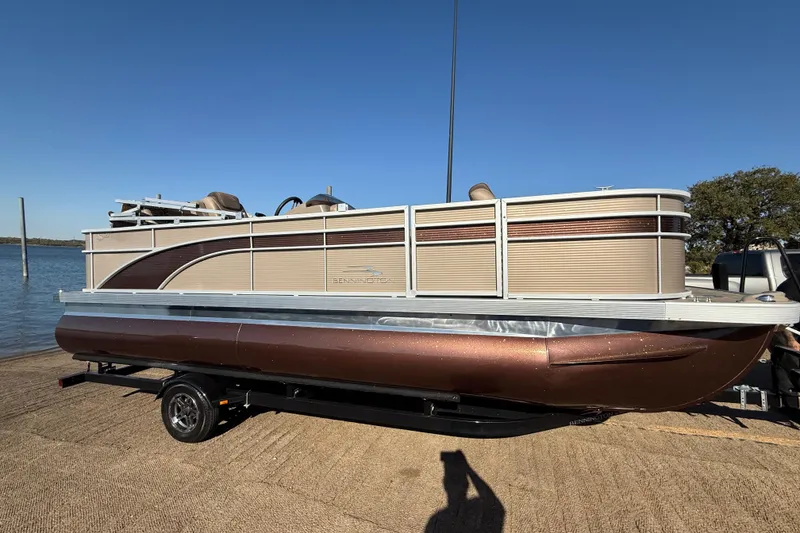 Slide: The Image of Close-up of a 2020 Bennington 21SF trailer tire on asphalt. - 70