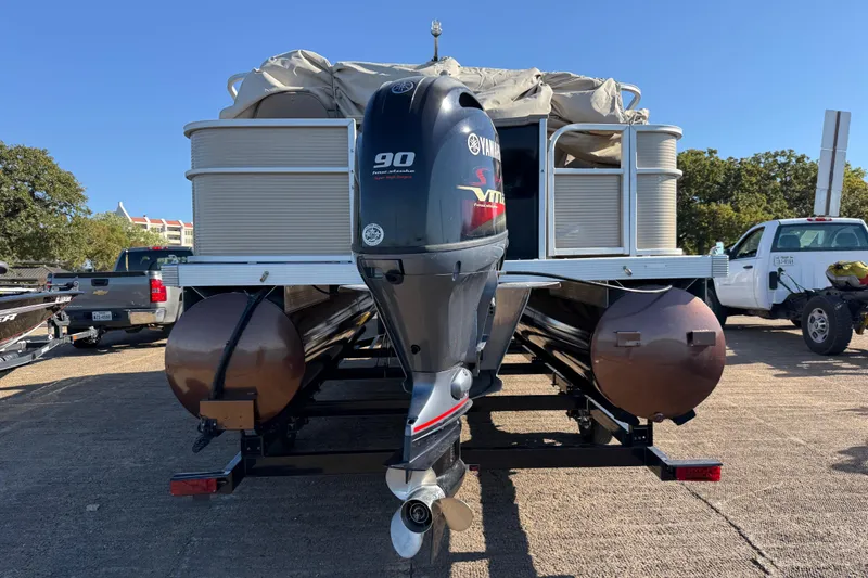 Slide: The Image of 2020 Bennington 21SF pontoon boat with Yamaha VMAX outboard motor in parking lot. - 80