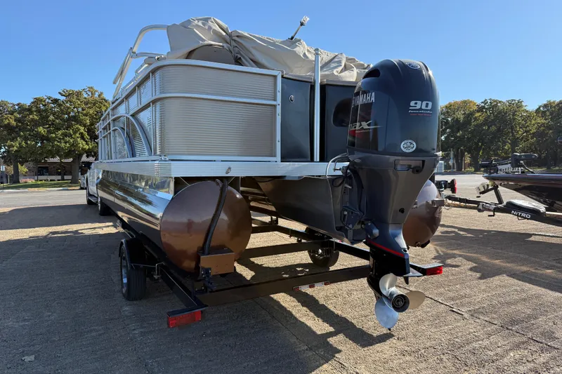 Slide: The Image of 2020 Bennington 21SF pontoon boat with Yamaha 90 outboard motor on trailer. - 81
