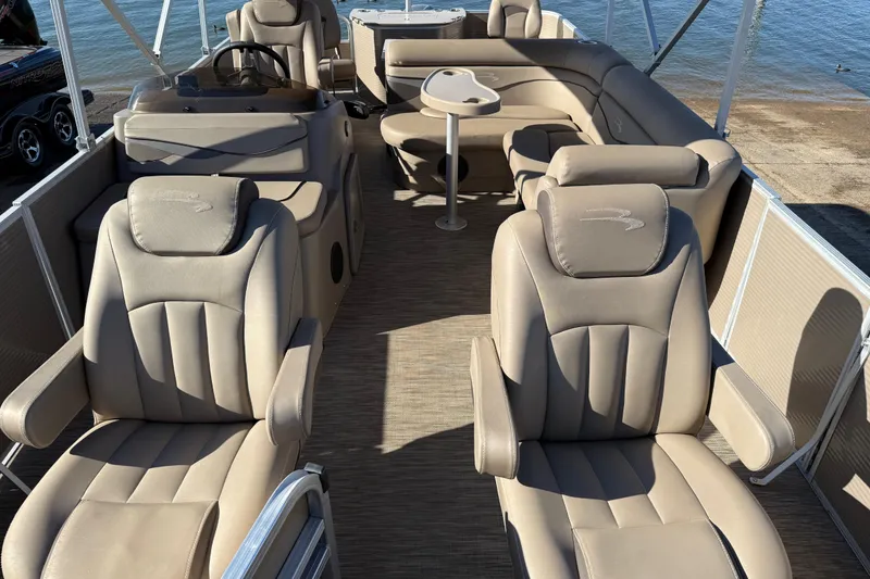 Slide: The Image of Luxurious seating on a 2020 Bennington 21SF boat, featuring plush beige upholstery. - 90