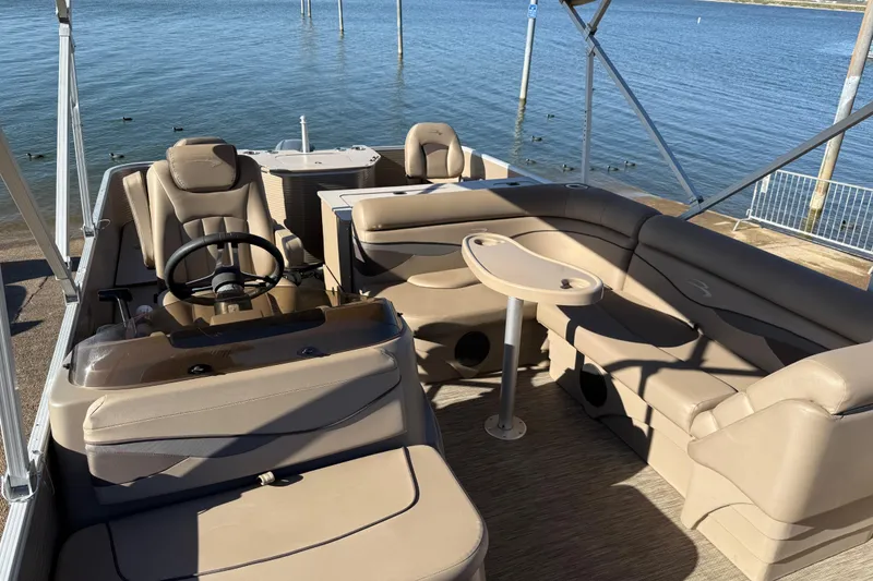 Slide: The Image of Battery compartment of 2020 Bennington 21SF boat with wiring and green battery. - 92