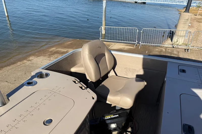 Slide: The Image of 2020 Bennington 21SF boat interior with steering wheel and beige seating. - 98