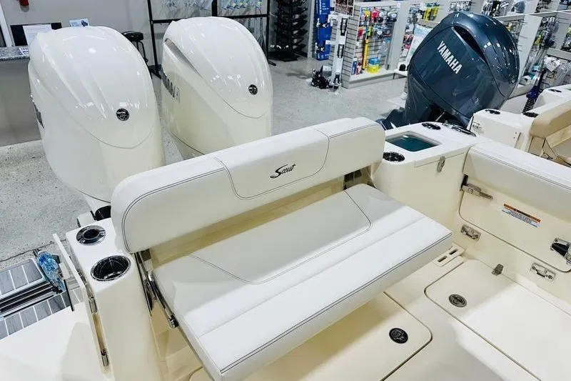 Slide: The Image of 2026 Scout 277 Dorado boat interior with dual engines and seating area. - 14