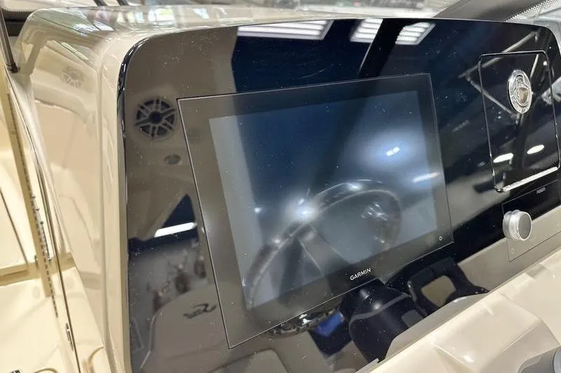 Slide: The Image of 2026 Scout 277 Dorado dashboard featuring a Garmin display and control panel. - 4