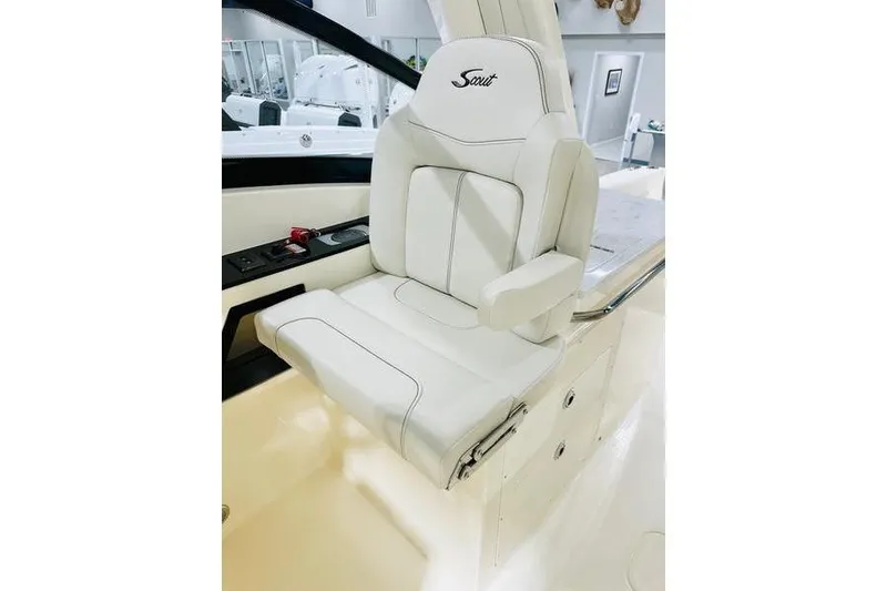 Slide: The Image of Luxury white seat in 2026 Scout 277 Dorado boat interior. - 5
