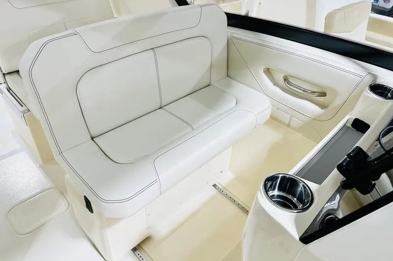 Slide: The Image of Luxurious seating in the 2026 Scout 277 Dorado boat interior, featuring cup holders. - 6
