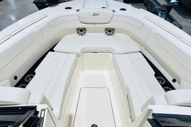 Slide: The Image of Luxurious interior of 2026 Scout 277 Dorado boat with white seating and speakers. - 8