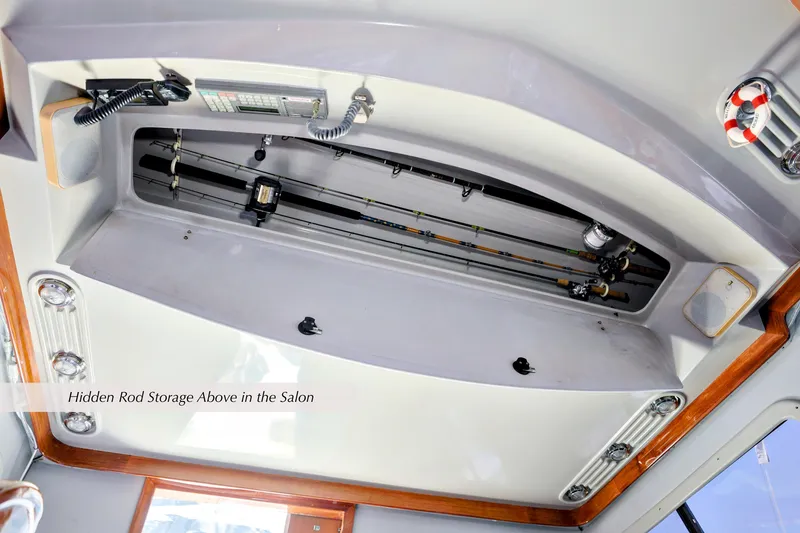 Slide: The Image of Hidden rod storage in 1993 Mediterranean 38 Convertible yacht salon ceiling. - 10