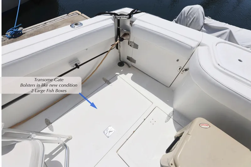 Slide: The Image of 1993 Mediterranean 38 Convertible boat deck with transom gate and fish boxes. - 21