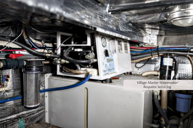 Slide: The Image of Engine room of 1993 Mediterranean 38 Convertible with Village Marine watermaker needing service. - 27