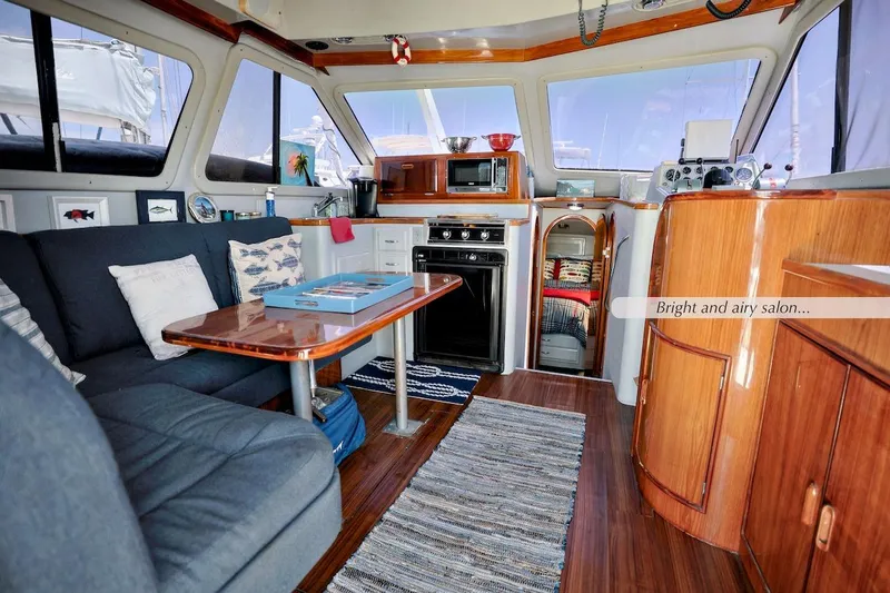 Slide: The Image of Bright and airy salon in 1993 Mediterranean 38 Convertible yacht interior. - 4
