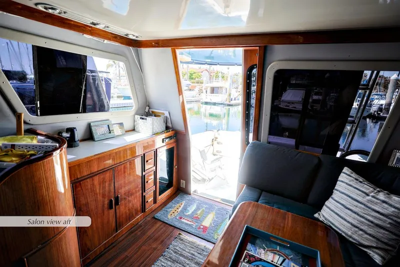 Slide: The Image of Interior of 1993 Mediterranean 38 Convertible yacht with wooden cabinetry and marina view. - 5