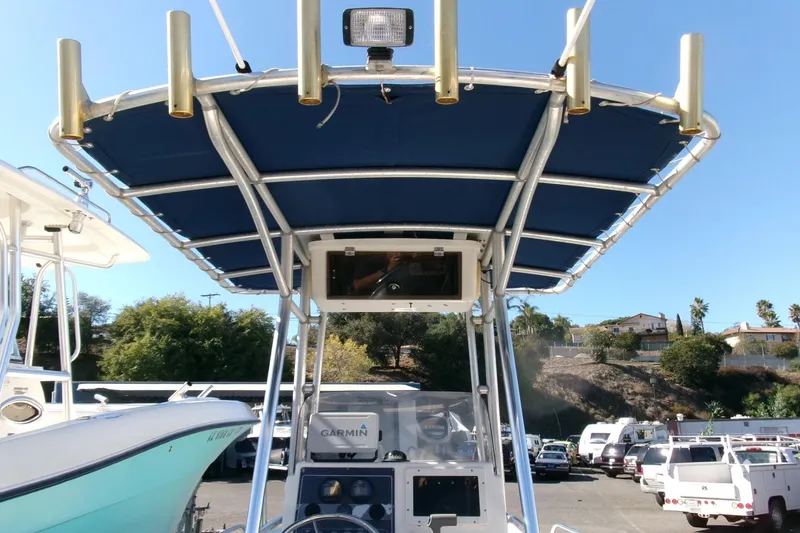 Slide: The Image of 2001 Sea Fox 215 Bay Fisher boat with blue canopy and Garmin equipment. - 12