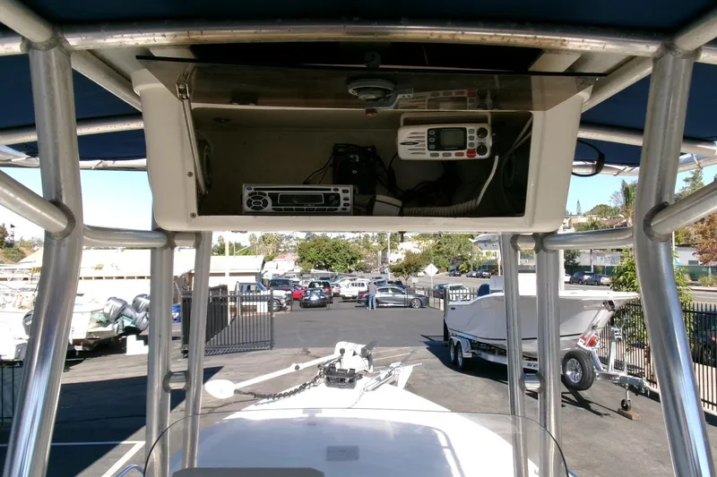 Slide: The Image of 2001 Sea Fox 215 Bay Fisher boat console with electronics, parked in a marina. - 14