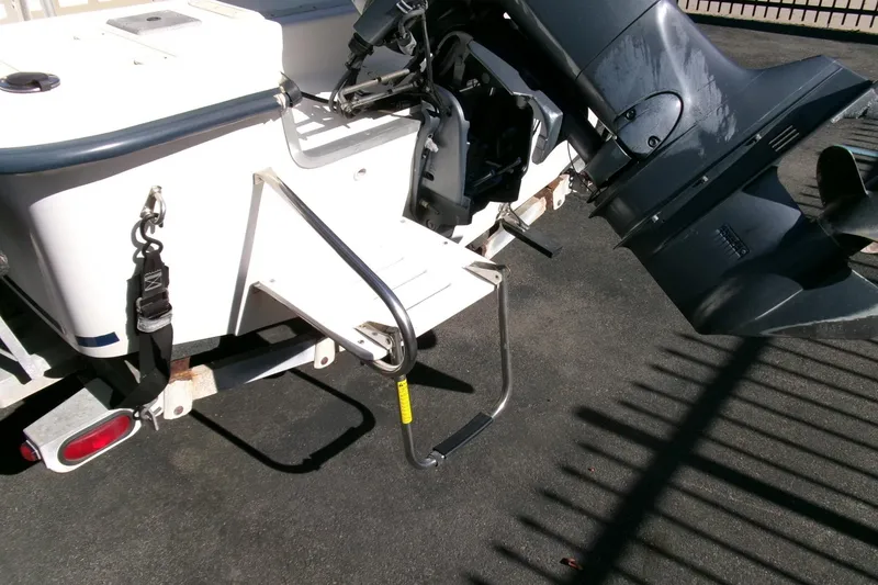 Slide: The Image of Rear view of 2001 Sea Fox 215 Bay Fisher boat with motor and ladder. - 19