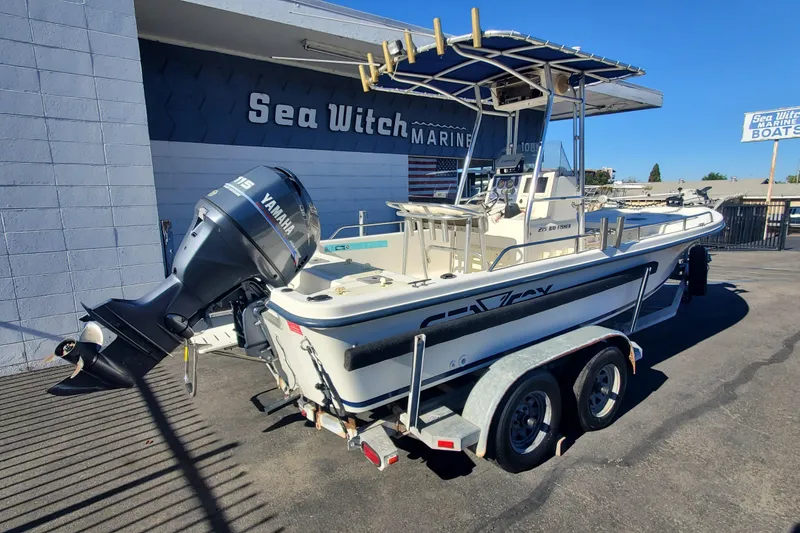 Slide: The Image of 2001 Sea Fox 215 Bay Fisher boat with Yamaha engine on trailer at Sea Witch Marine. - 2