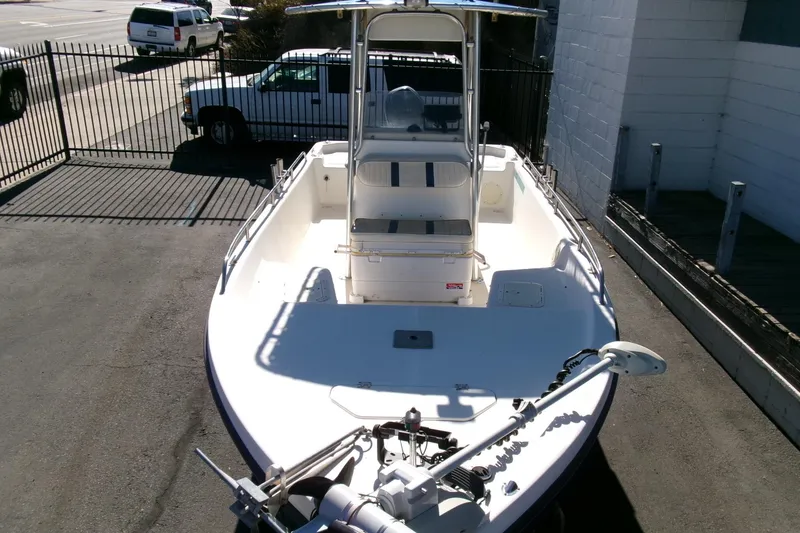 Slide: The Image of 2001 Sea Fox 215 Bay Fisher boat with center console, parked on pavement. - 20